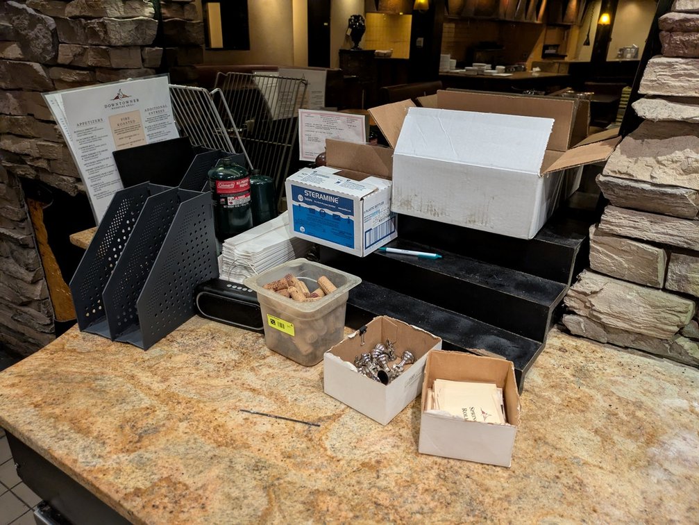Assorted Supplies Behind Bar