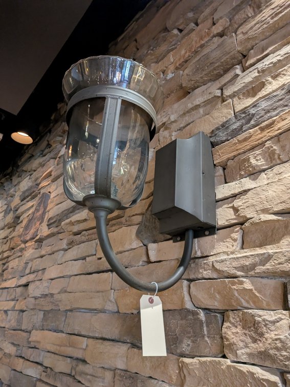 Wall-Mount Gas Lamps Behind Bar