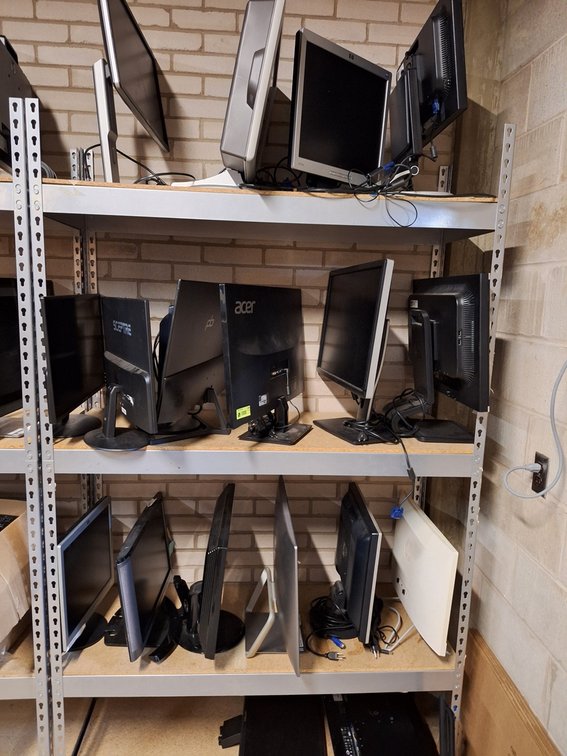 Assorted Computer Components on Shelves, Monitors, Printers and More