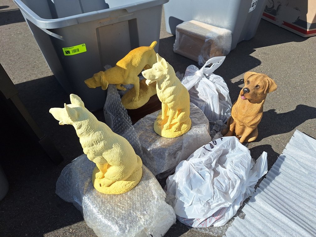 Crate of Dog Figurines