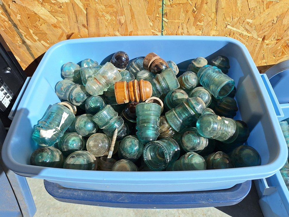 2 Bins Assorted Glass and Clay Insulators