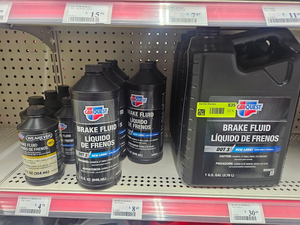 14 Assorted Brake Fluid Jugs