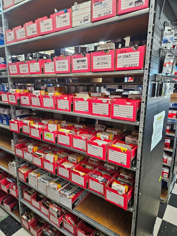 Assorted NGK, Champion, Autolite and Fram Spark Plugs in Section
