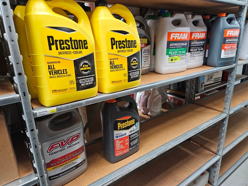 Assorted Anti Freeze Gallon Jugs in Section