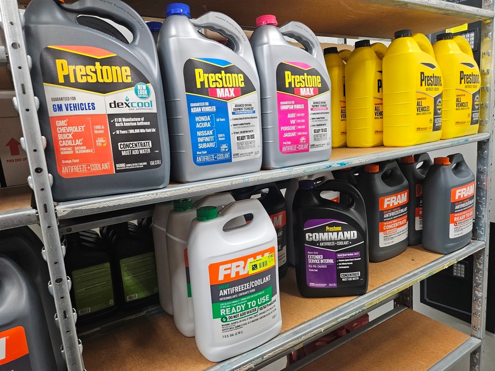 Assorted Anti Freeze Gallon Jugs in Section