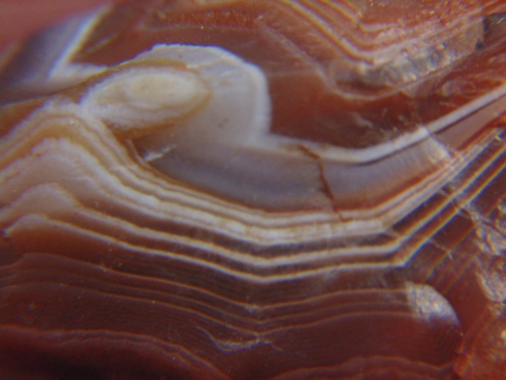 A.07 oz Lake Superior Agate that is loaded with banding