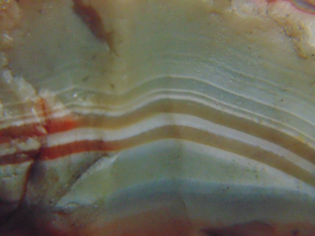 A 1.1 oz Lake Superior Agate that is full of unusually colored banding