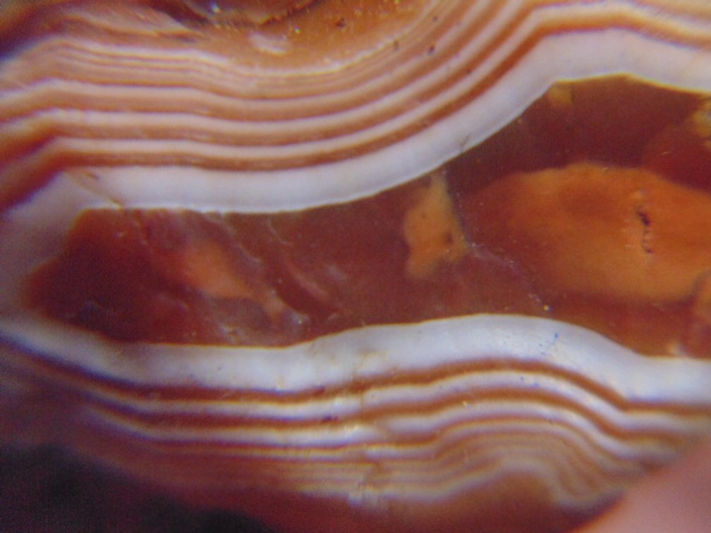 A .7 oz Lake Superior Agate with a nice red and white banded face
