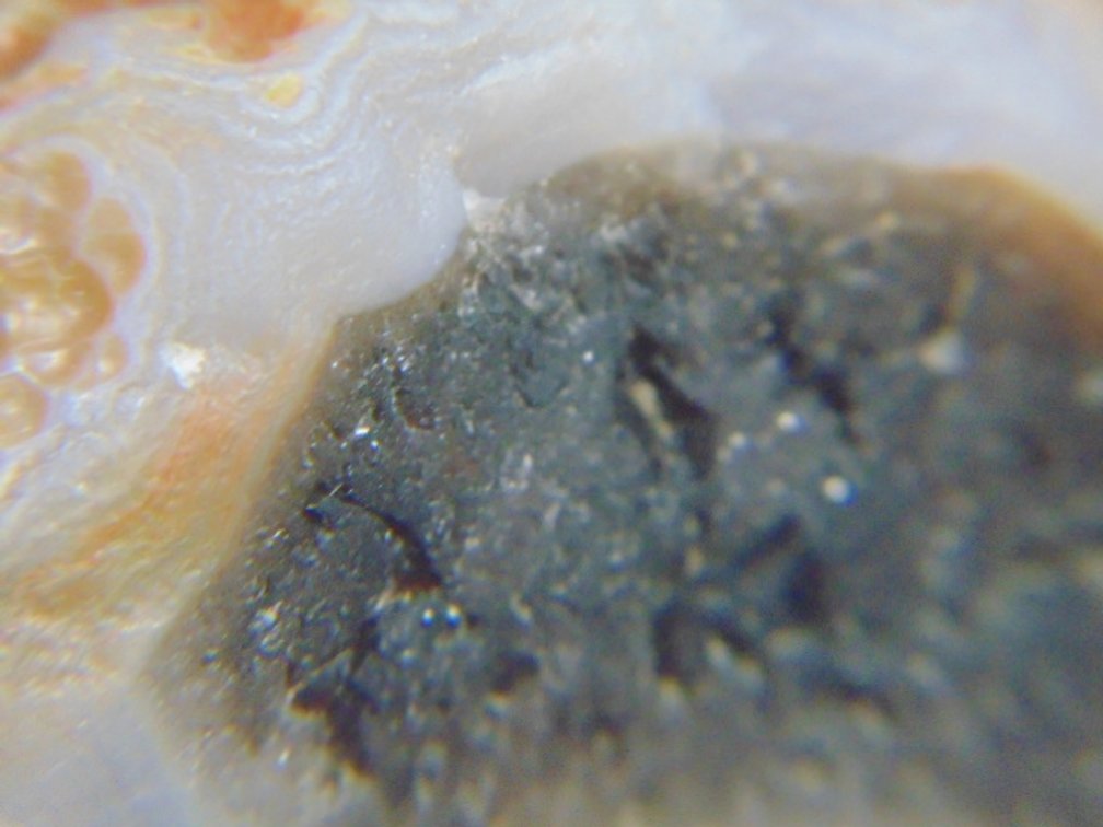 A .9 Lake Superior Agate with a center pocket of dark Amethyst