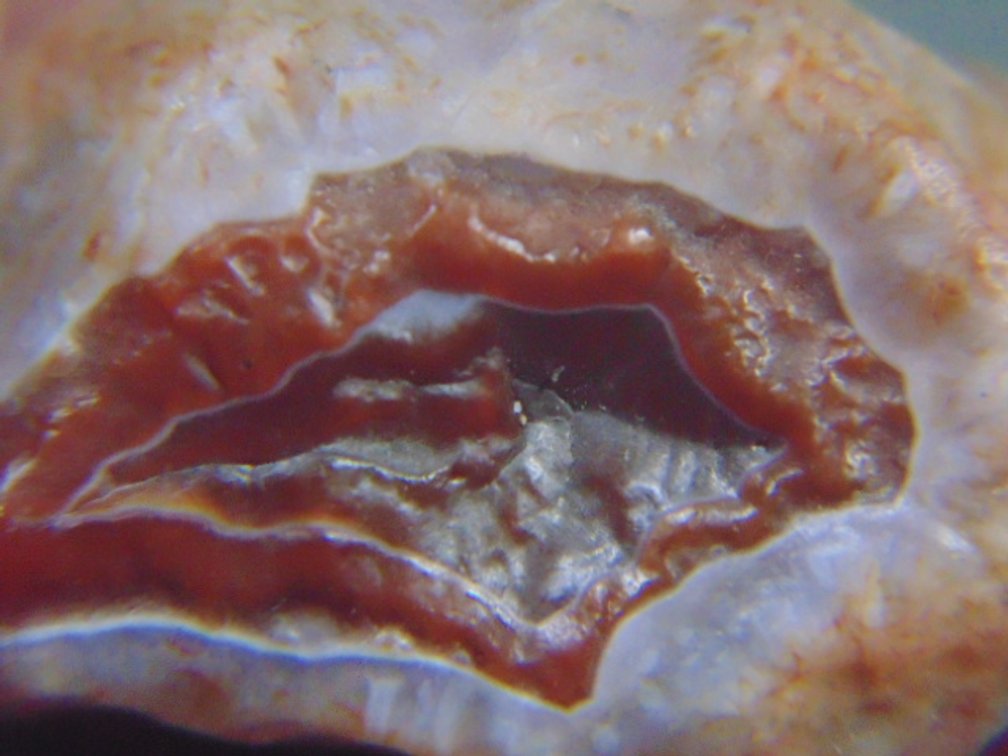 A .9 oz  Lake Superior Agate with a nice banded face and a unique husk