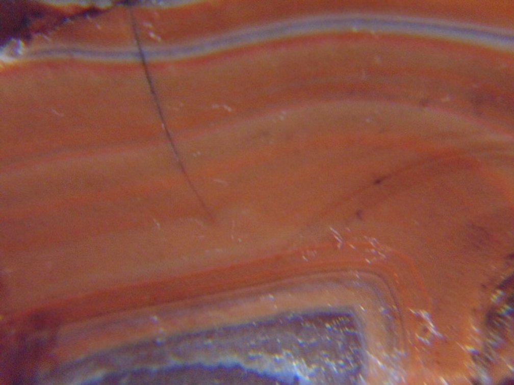 A 1.3 oz Lake Superior Agate full of nice orange banding along with a pocket of quartz