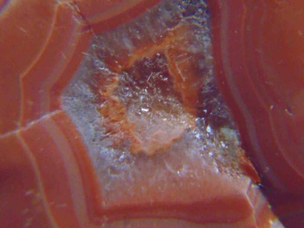 A 1.3 oz Lake Superior Agate with a nice red banded face along with some eyes and has a satin finish