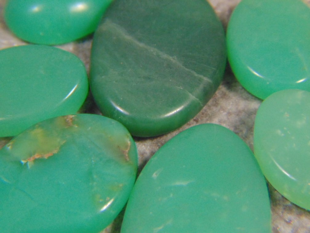 Six Chrysocolla cabs plus an unknown cab