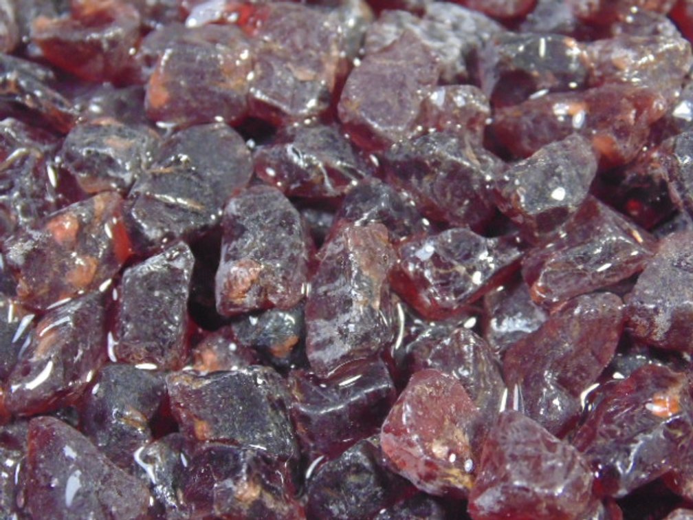 An assortment of faceting and cabbing grade Garnets, 5.7 ozs