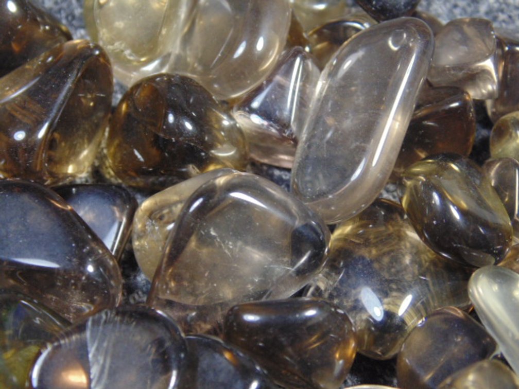 An assortment of faceting and cabbing grade dark Citrine, 5.5 ozs