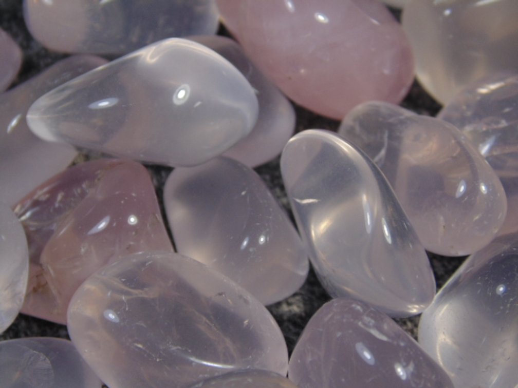 An assortment of faceting and cabbing grade Rose Quartz, 8.3 ozs