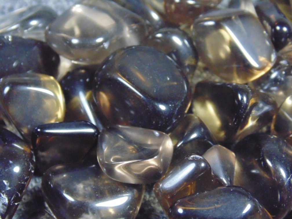 An assortment of faceting and cabbing grade dark Citrine, 5.4 ozs