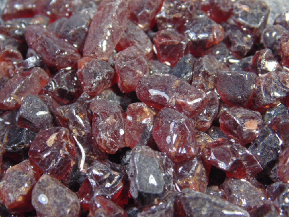 An assortment of faceting and cabbing grade Garnets, 4.8 ozs
