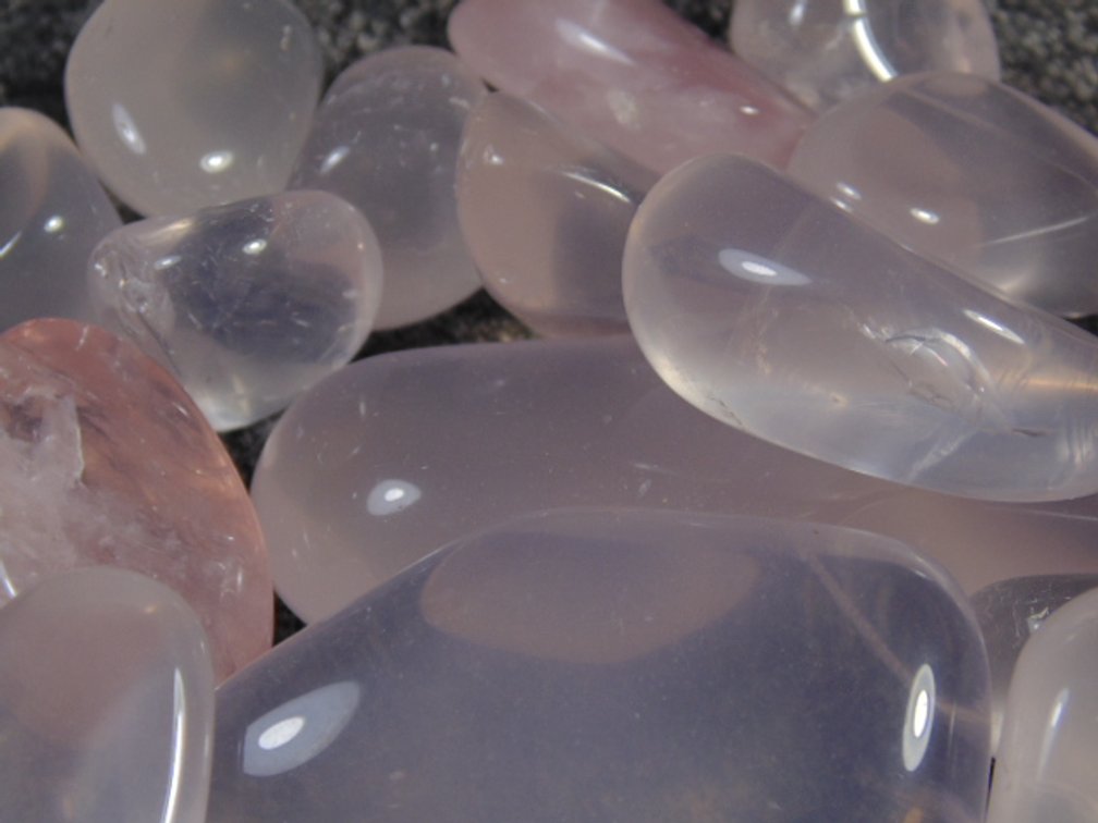 An assortment of faceting and cabbing grade Rose Quartz, 7.8 ozs