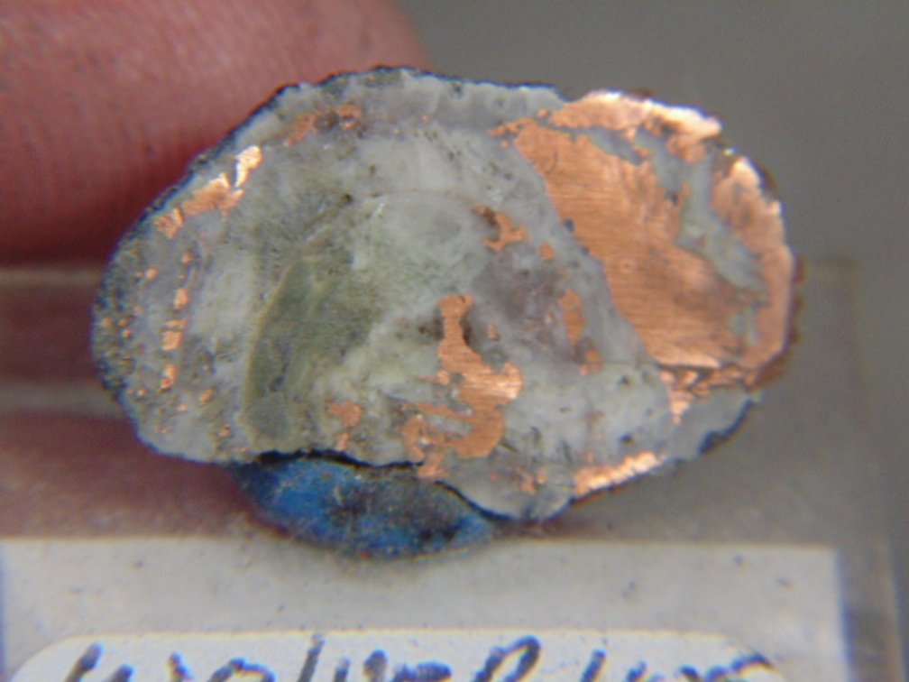 A Copper Replacement Agate half on an acrylic stand from the Wolverine Mine, 2.6 grams