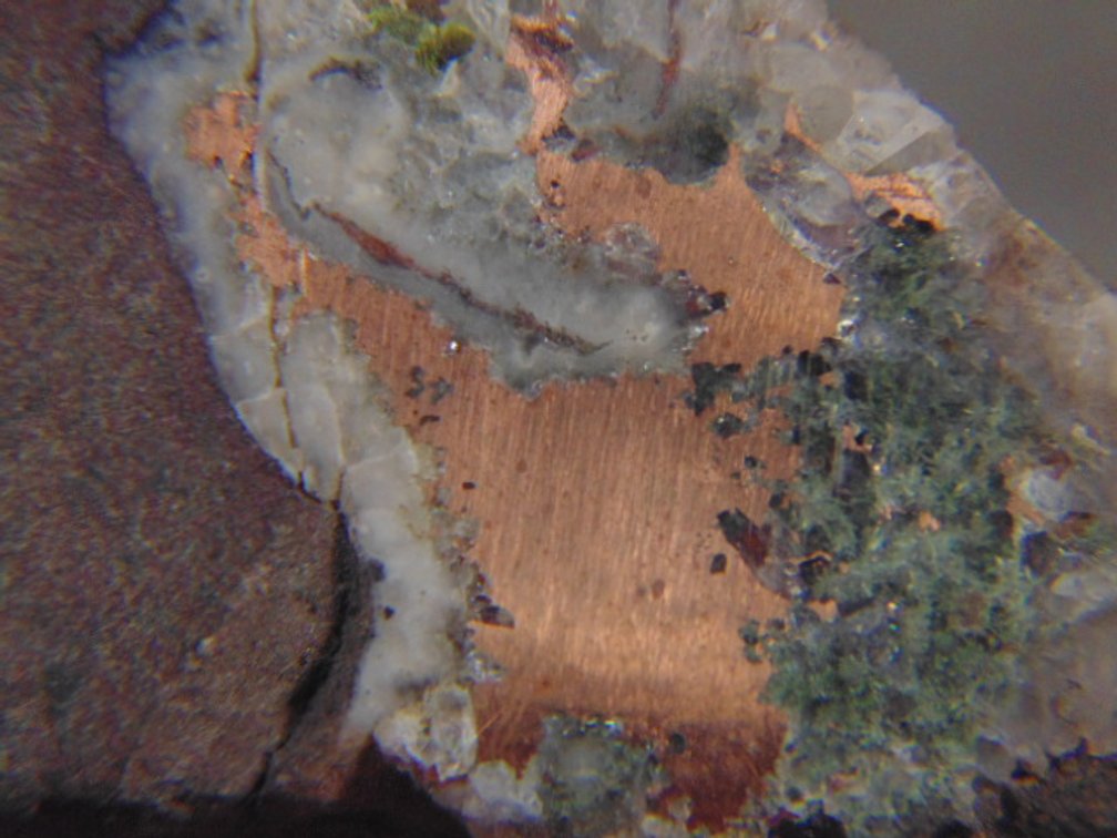A face polished Copper Replacement Agate in matrix, 21.6 grams