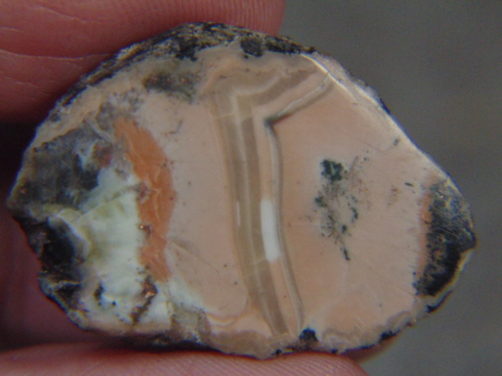 A face polished Copper Replacement Agate, 7.2 grams