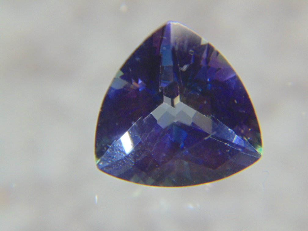 A trillion cut faceted stone possibly Topaz