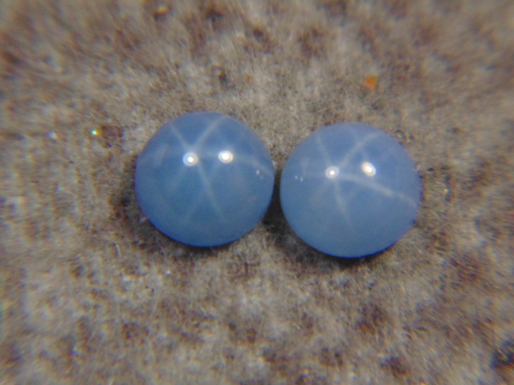 Two 4 mm Linde Star Sapphire cabs, 1.35 ct