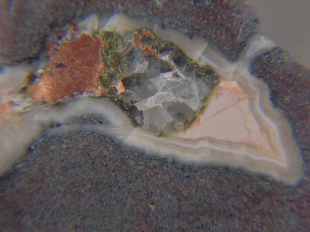 A face polished Copper Replacement Agate in matrix, 9.8 grams