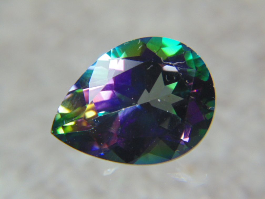 A 20 x 15 mm teardrop Mystic Topaz, 20 cts