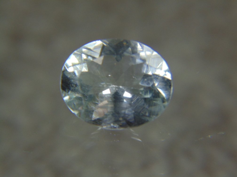 A oval faceted stone