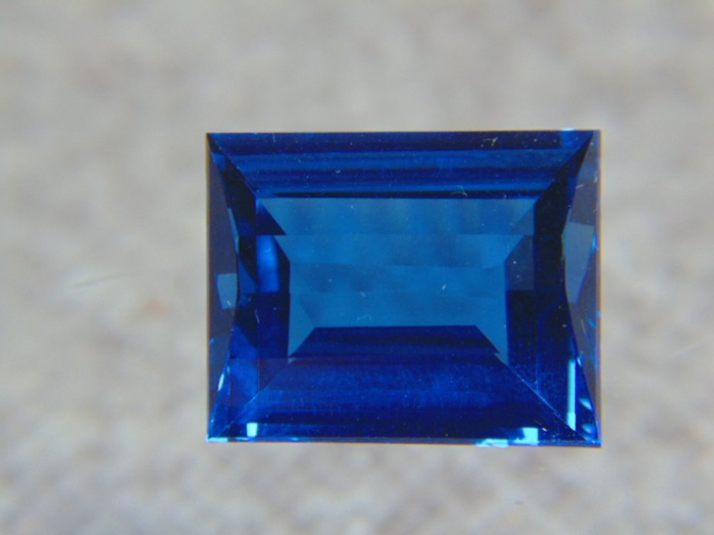 A rectangle blue faceted stone