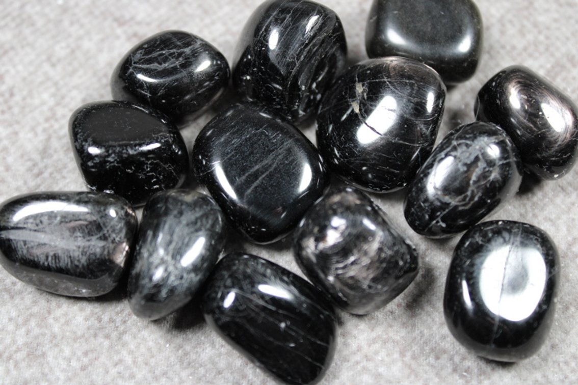 Several polished Hypersteen stones, 5.4 ozs