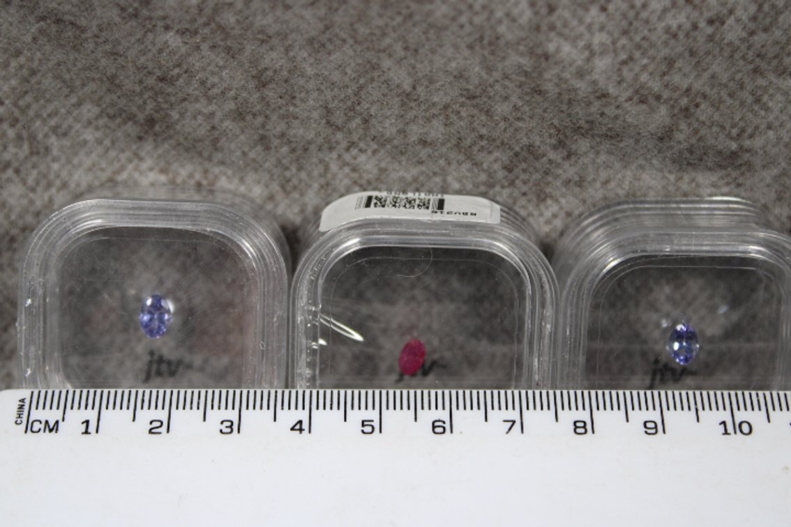 Three faceted stones possible Ruby and Tanzanite