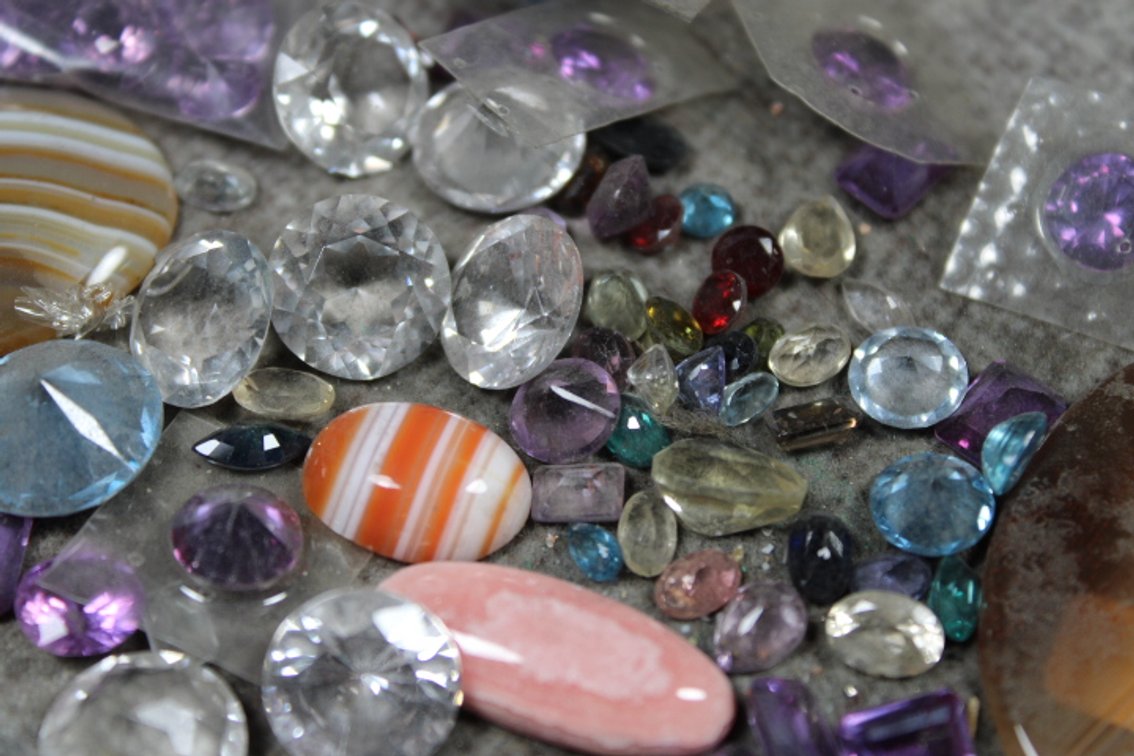 A variety of faceted stones and cabs