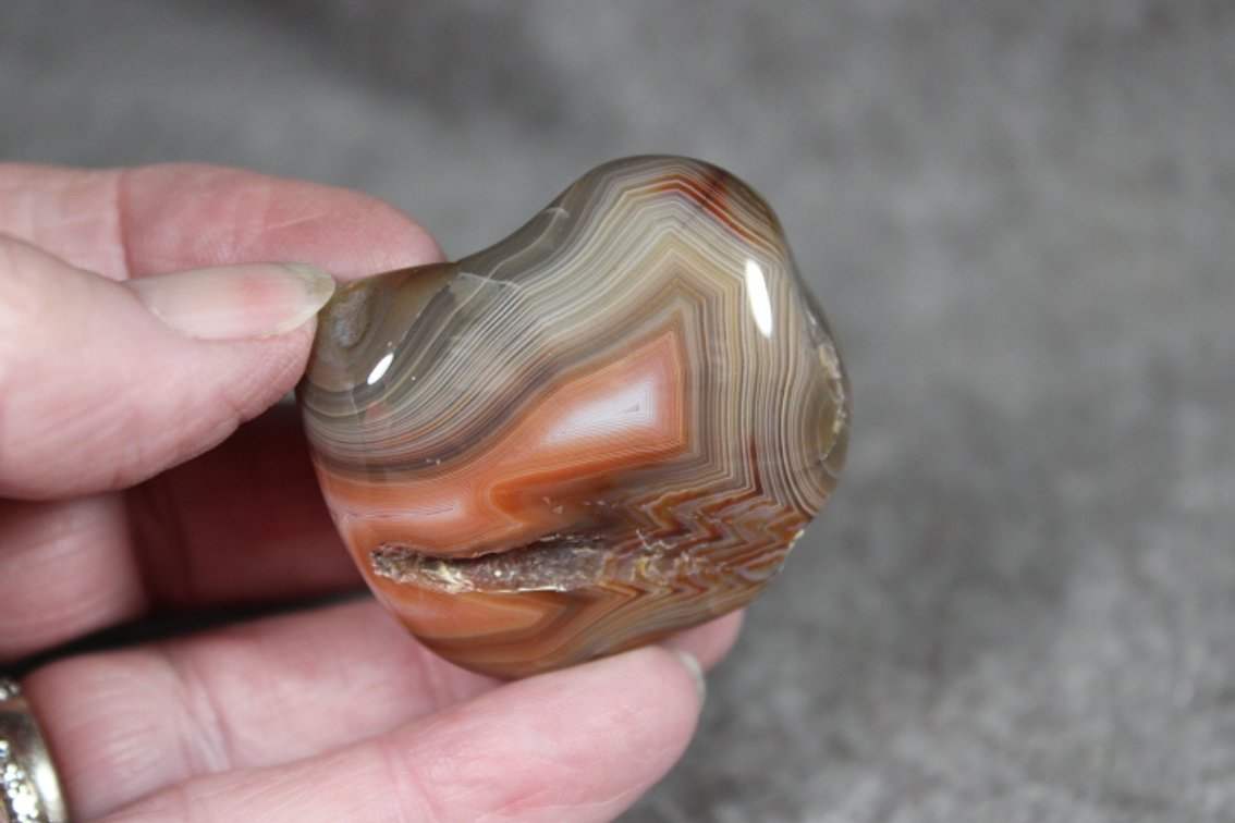 A 1.4 oz tumbled polished Lake Superior Agate with lots of shadowing