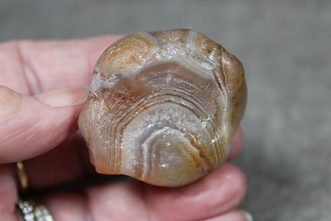 A natural 1.6 oz Lake Superior Agate with shadowing