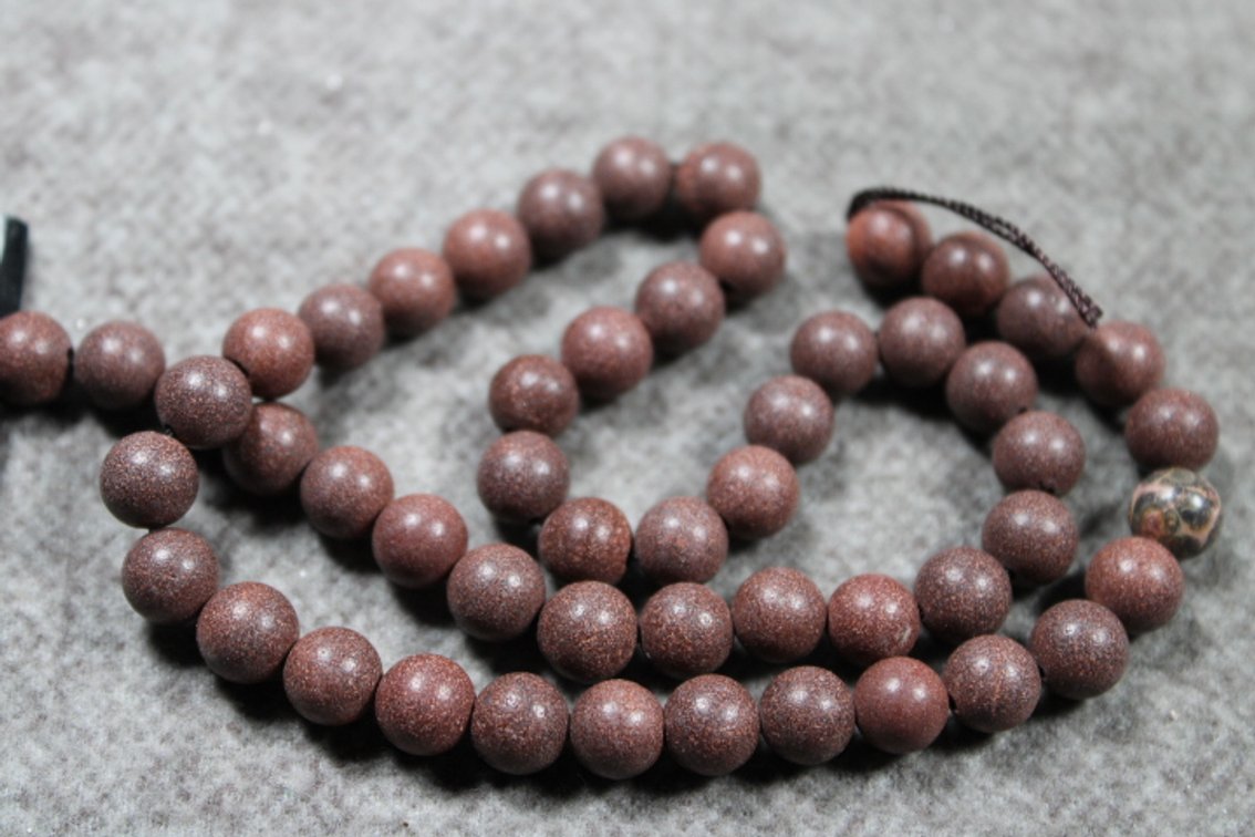 A 15" strand of 8 mm Spotted Quarry Pipestone beads