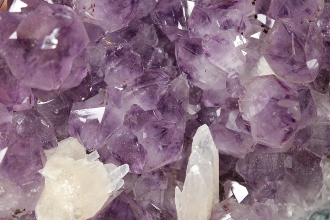 A 2 lb 12 oz Amethyst with a couple Calcite formations along with agate banding