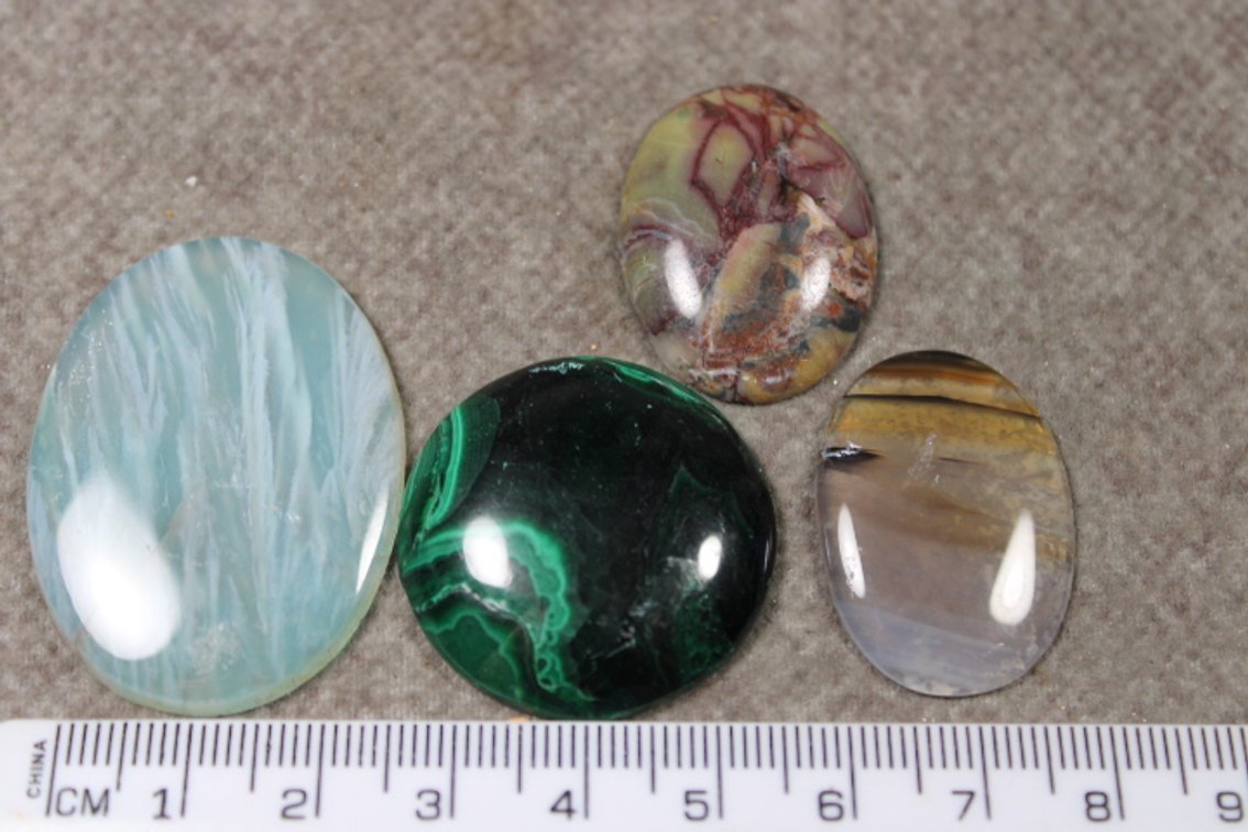 An assortment of four cabochons