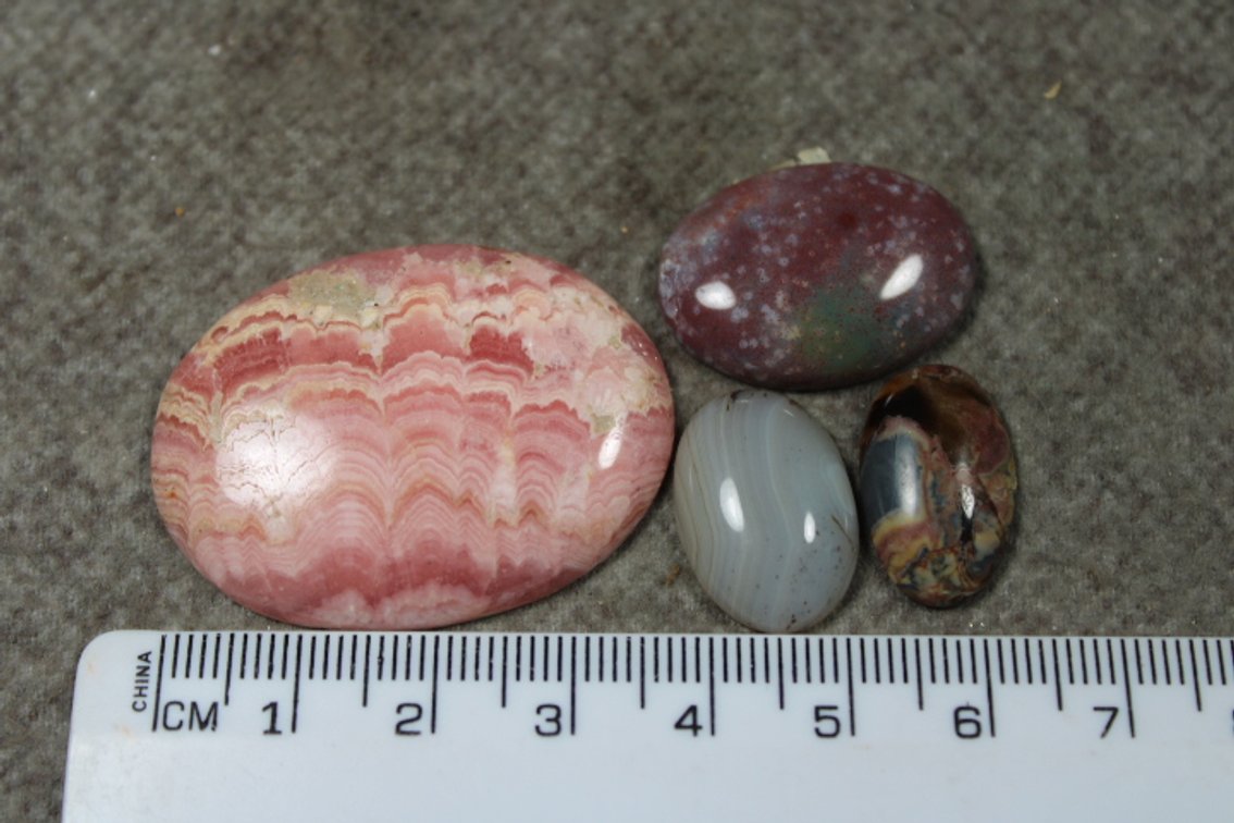 An assortment of four cabochons