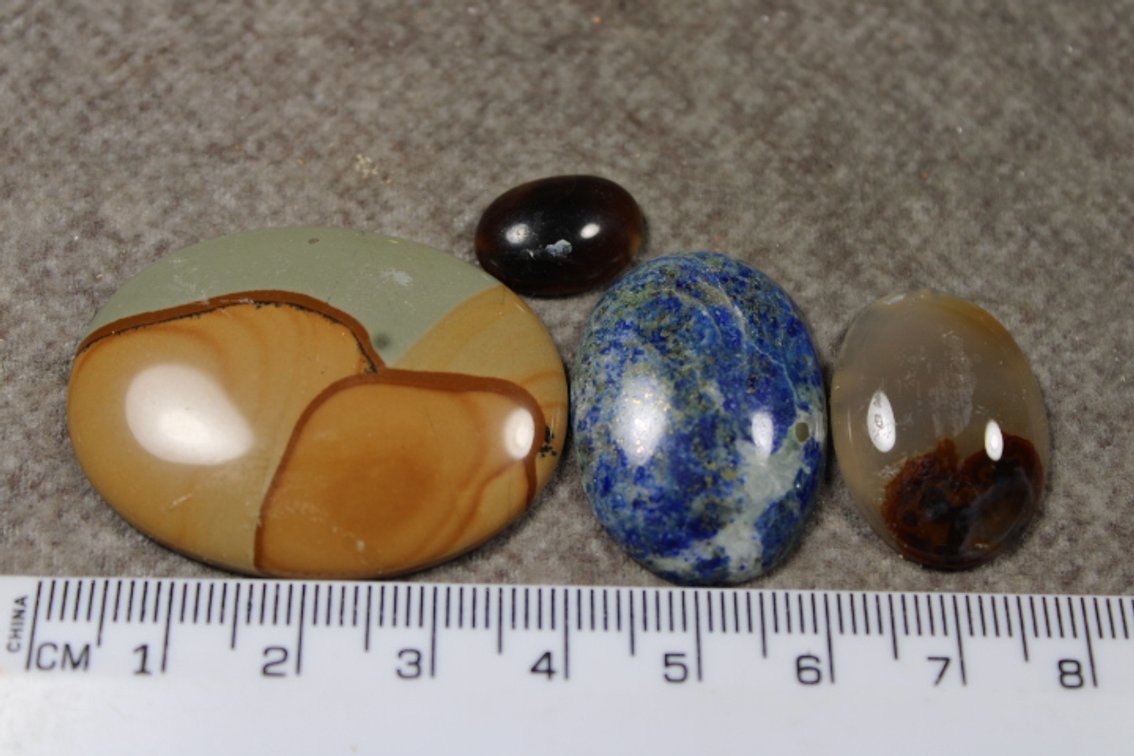 An assortment of four cabochons