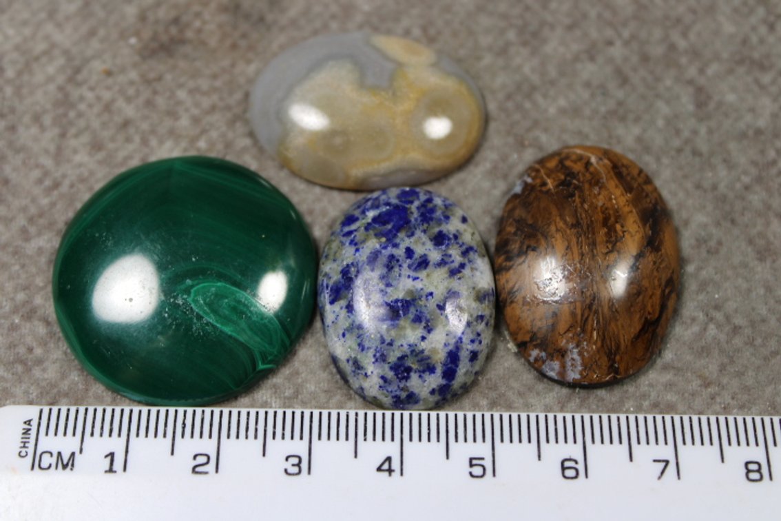 An assortment of four cabochons