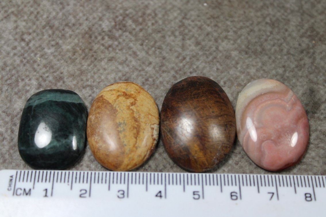 An assortment of four cabochons