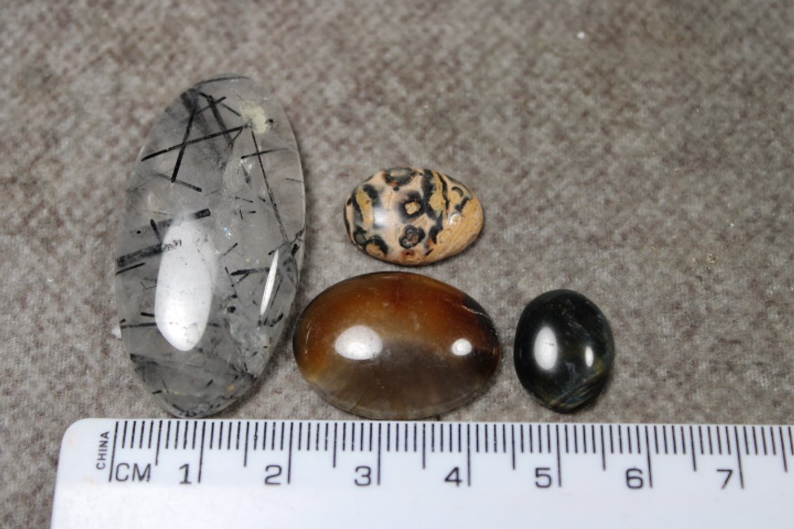 An assortment of four cabochons