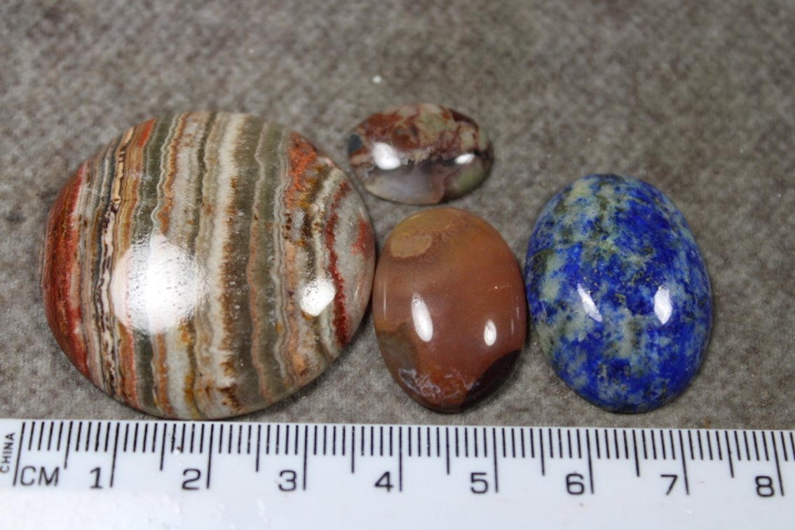 An assortment of four cabochons