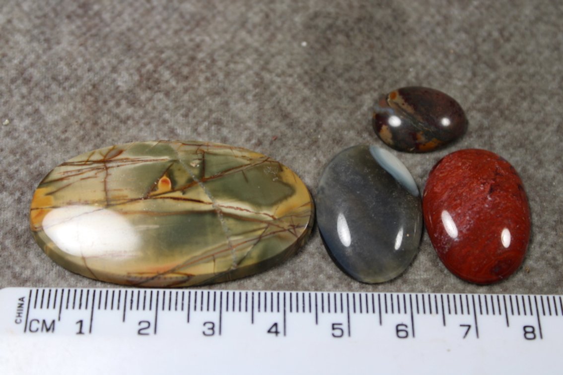 An assortment of four cabochons