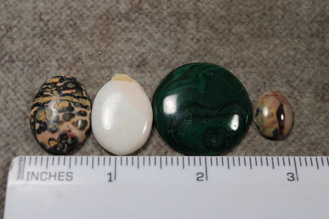 An assortment of four cabochons