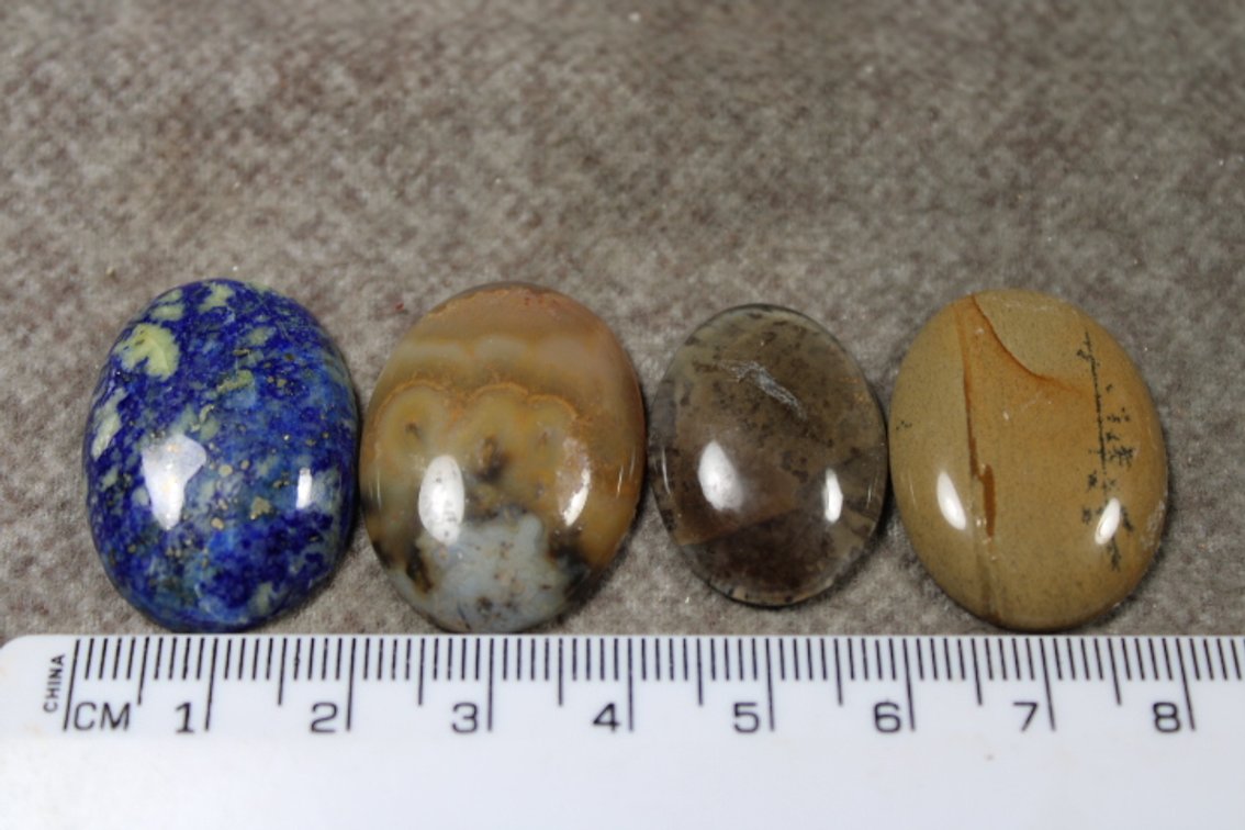 An assortment of four cabochons