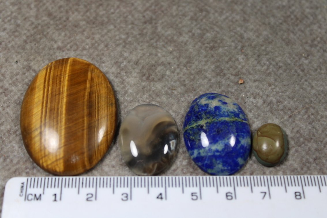 An assortment of four cabochons